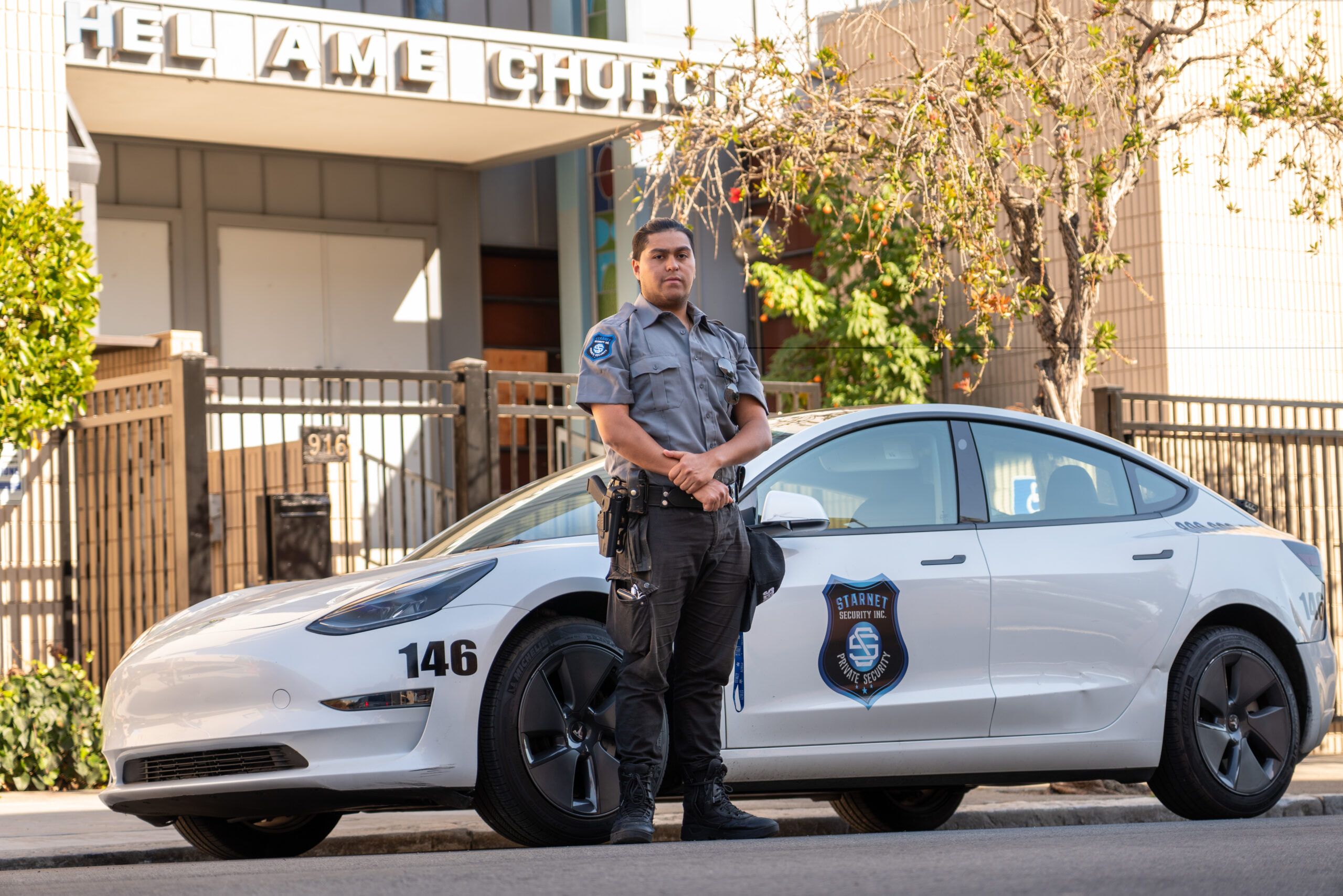 a man standing in front of a starnet security car